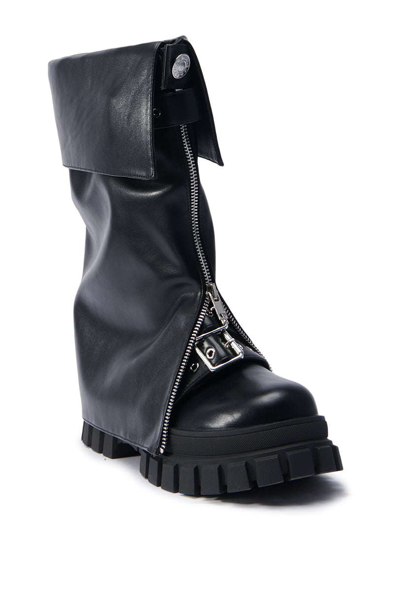 The AZALEA WANG MALEKO BLACK CHUNKY BOOT features a large front zipper that partially opens to show off a metallic buckle. This moto-style boot stands out with its thick, rugged sole and a folded flap at the top, contributing to its edgy, distinctive design.