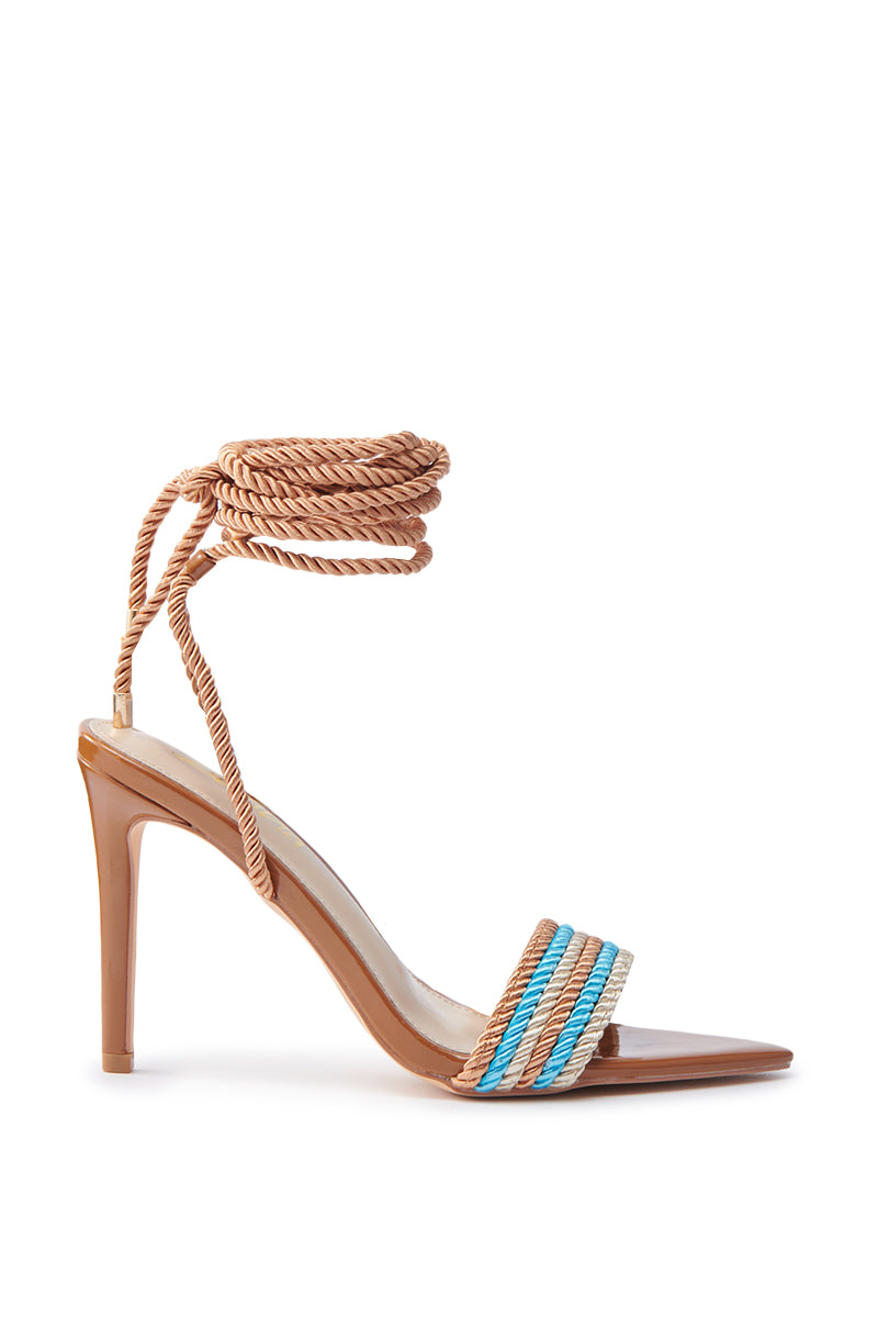 The MANSON BROWN ROPE STILETTO WRAP UP SANDAL is a chic and elegant high-heeled stiletto, featuring a tan sole, open-toe design, toe strap interwoven with blue, turquoise, and tan ropes, and an ankle wrap-around in tan rope.