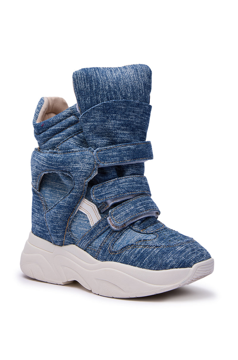 The MARANTO DENIM WEDGE SNEAKER features a chunky white sole, blue denim-textured upper, and three wide Velcro straps. It has a padded tongue and collar for comfort, plus a modern high-top athletic design.
