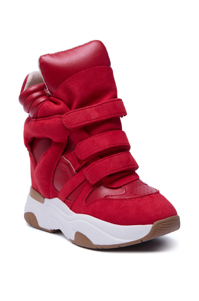 The MARANTO RED WEDGE SNEAKER features suede and faux leather panels, three velcro straps, a padded high-top collar, and a thick white flatform sole with brown accents for a stylish look.