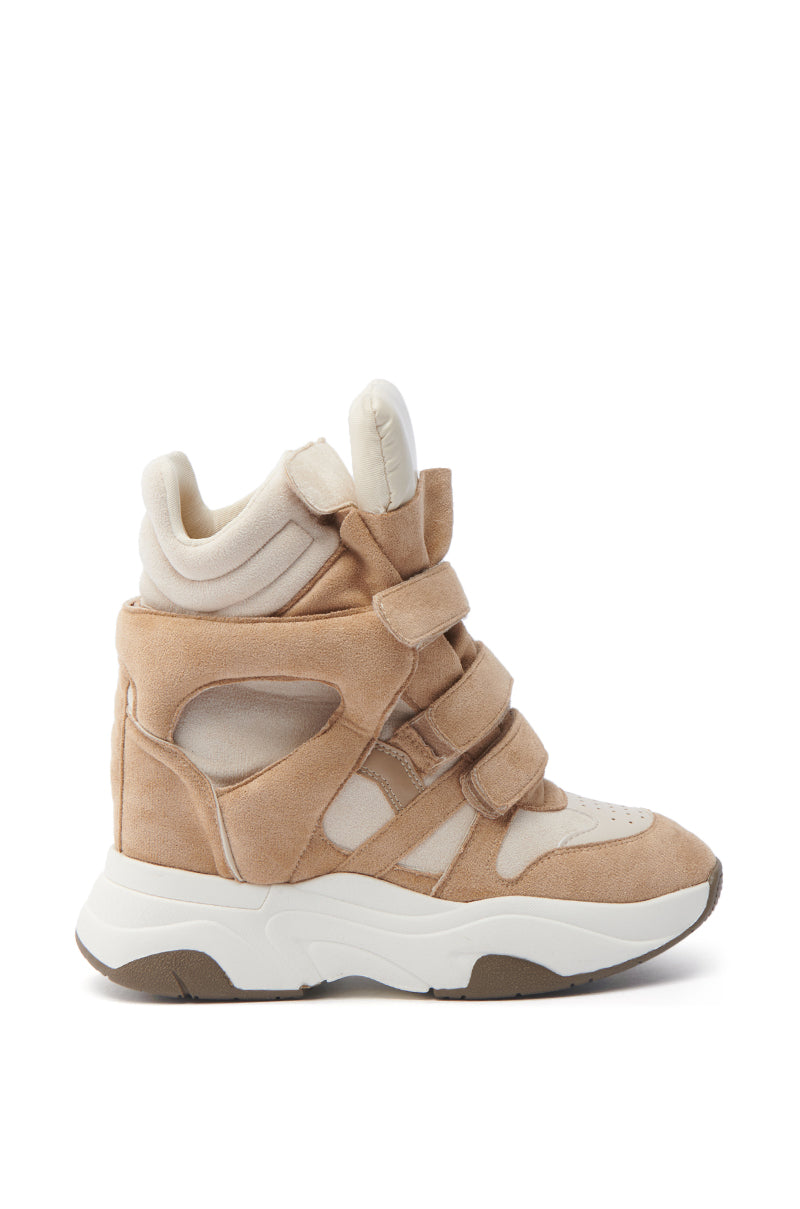 The MARANTO TAUPE WEDGE SNEAKER is a beige high-top with padded ankle support, three Velcro straps, and a concealed wedge heel. It features a thick white sole, uses a mix of suede, fabric, faux leather detailing, and cut-out accents with a rounded toe.