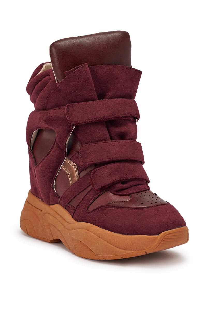 The MARANTO BURGUNDY WEDGE FAUX SUEDE SNEAKER features cut-out sides, velcro straps, a thick brown rubber sole, and padded tongue and collar—a bold high-top for standout streetwear style. 6