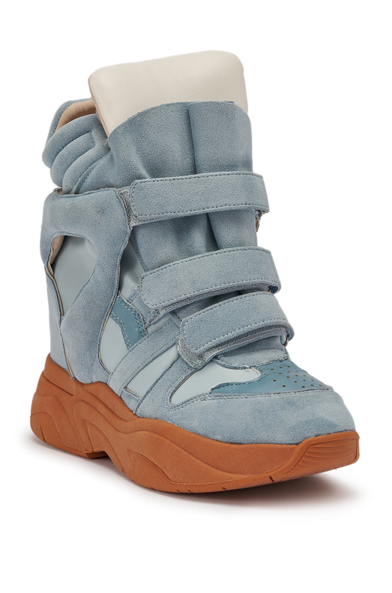 The MARANTO BLUE WEDGE FAUX SUEDE SNEAKER features light blue suede and leather panels, three hook-and-loop straps, a padded white tongue, and a chunky brown platform sole—ideal for elevating any trendy streetwear look. 5