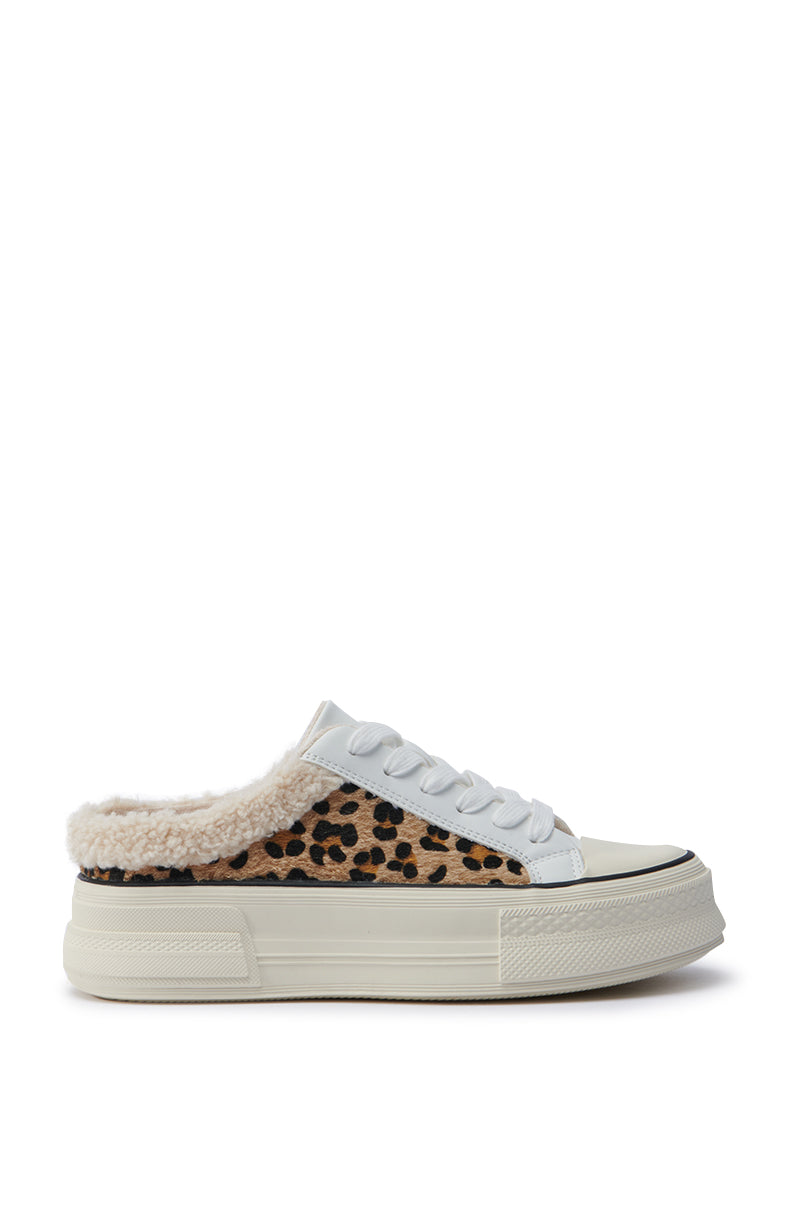 Introducing the AZALEA WANG MARGARITA FLAT SNEAKER: A chic faux leather platform sneaker with a sleek white sole, classic white laces, and a plush furry lining for added comfort. Its standout feature is the striking cheetah print pattern adorning the sides.