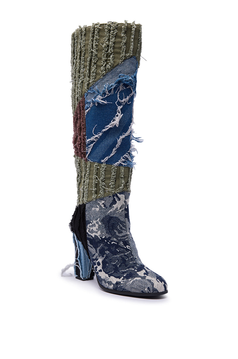 The AZALEA WANG MARGEE MULTI CHUNKY KNEE HIGH BOOT features a tall, eclectic design crafted from mismatched blue, green, and brown denim patches with frayed edges for a bold, textured look.