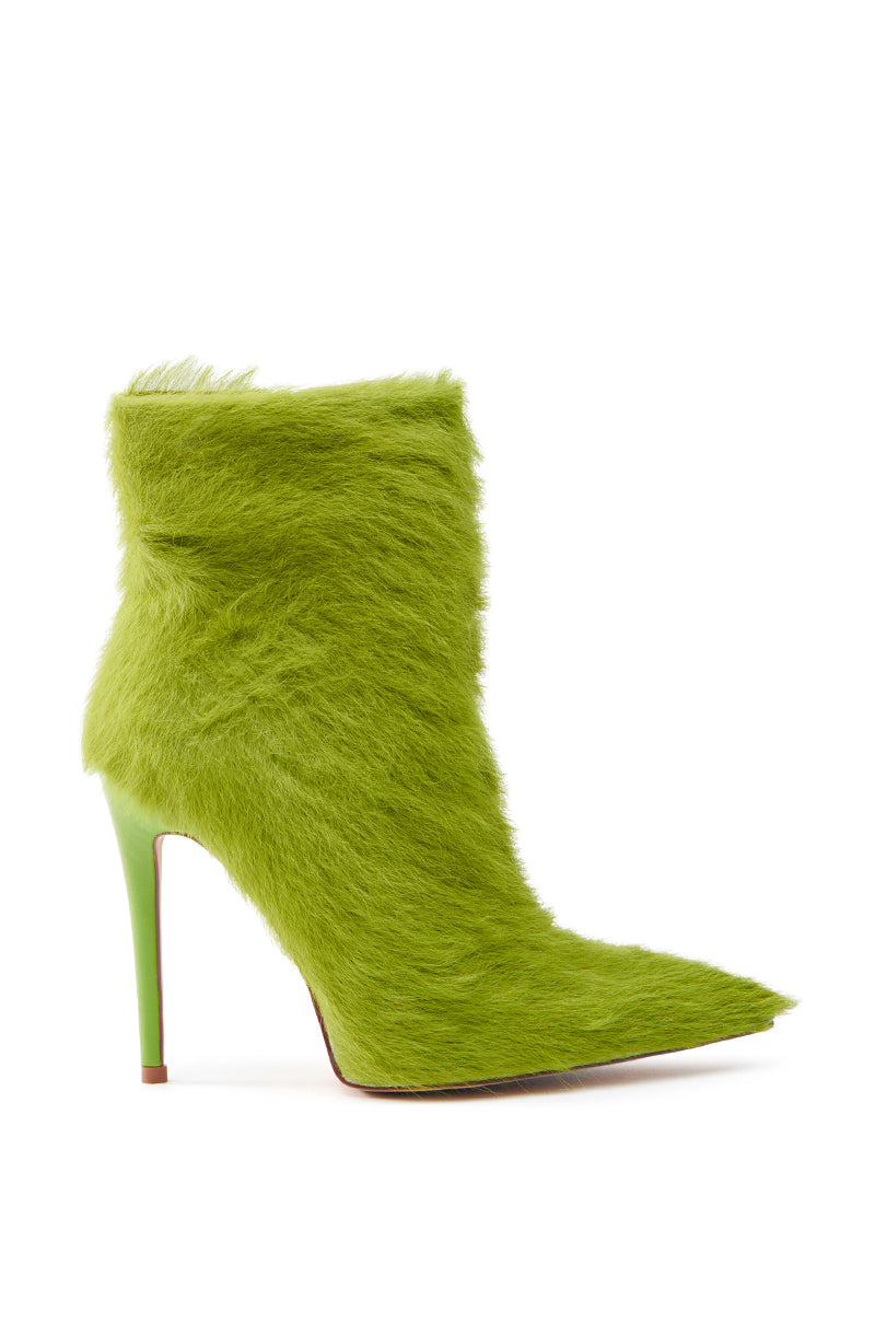 The AZALEA WANG MARIELLA GREEN HAIRY STILETTO BOOTIE is a striking ankle-high design with a pointed toe in vibrant green faux fur, making a bold fashion statement against a crisp white background.