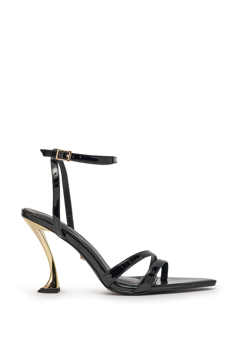 The AKIRA GOLD MARKOVA BLACK POINTED TOE STILETTO is a black faux leather heel with a skinny ankle strap and shiny gold metallic stiletto, ideal for evenings, shown against a white background. 3