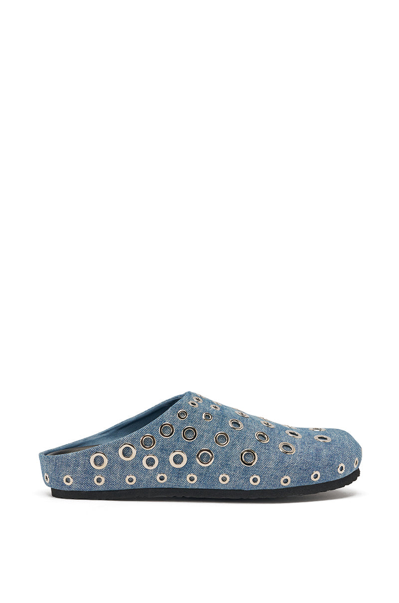 The AZALEA WANG MARSHA DENIM GROMMET DETAIL FLAT is a blue denim slip-on clog with a black sole, showcasing street style and bold silver grommets of varying sizes on the upper. 4