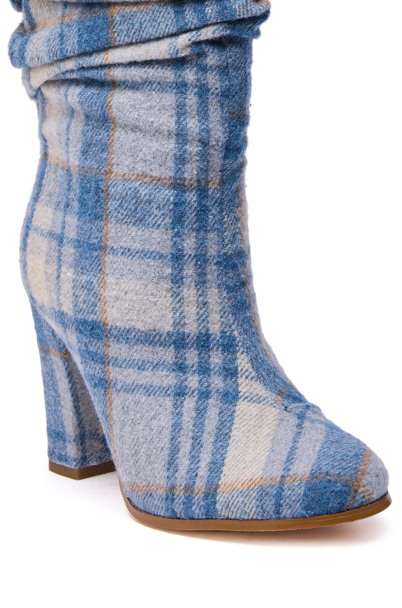 The AZALEA WANG MATHAIS BLUE MULTI PLAID ROUND TOE BOOTIE showcases soft blue and beige plaid fabric with a rounded toe and chunky heel for both style and comfort.