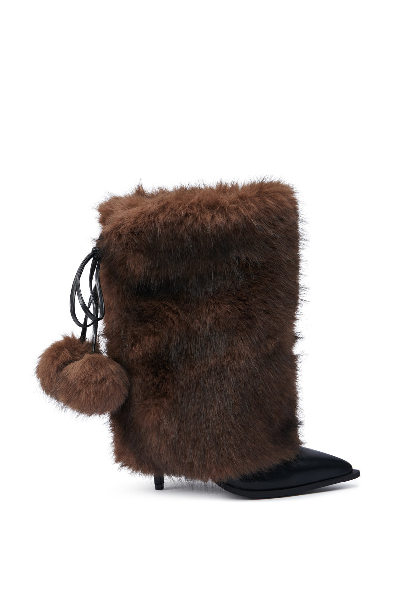 The AZALEA WANG MAYRA BROWN BOOTIE is a brown furry boot with a black pointed toe and stiletto heel, highlighted by a mid-calf shaft and embellished with black lace-up detailing on the side, complete with a small furry pom-pom.