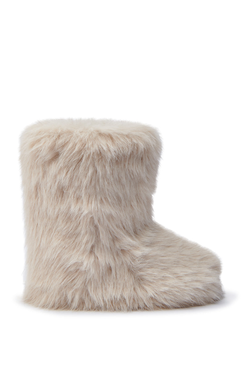 The MELANIE BEIGE FURRY BOOTIE features a fuzzy, cream-colored faux fur design with a soft, fluffy texture and a flat sole. Displayed from the side against a white background, this bootie includes a round toe.