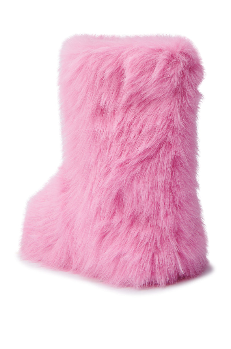 The MELANIE PINK FURRY BOOTIE, showcasing a high cuff, is displayed on a white background. This boot features a cozy sherpa lining and presents a soft, fluffy appearance that perfectly combines fashion with a cozy, playful aesthetic. 5