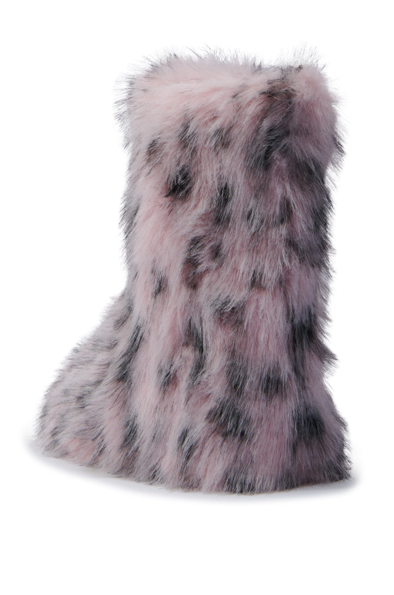 The Melanie Pink Leopard Furry Bootie, featuring a plush faux fur-like texture with gray spots, stands elegantly against a white background, making it an ideal choice for embracing cold weather style.