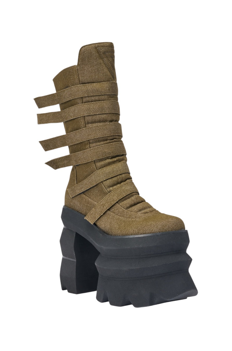 The AKIRA GOLD MENACING OLIVE BLOCK PLATFORM BOOTIE features olive green fabric, multiple horizontal straps, a chunky block heel, high platform sole, and sculpted black detail—ideal statement streetwear boots. 4