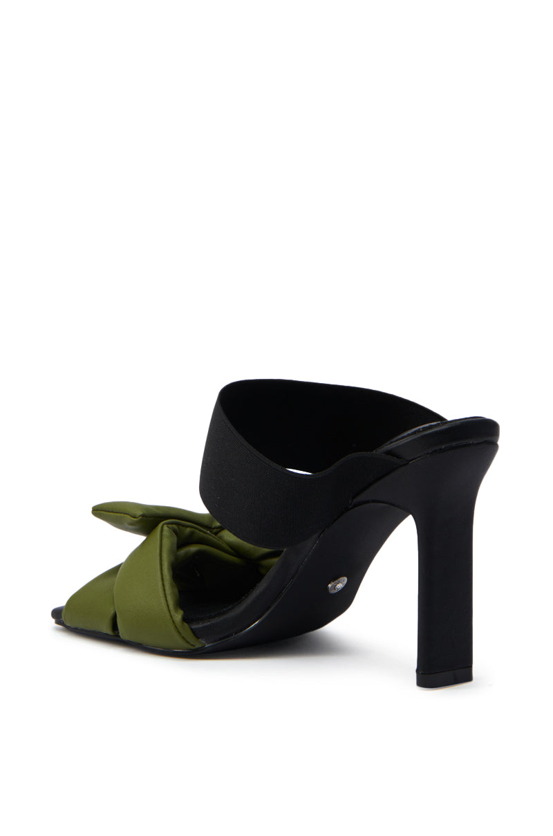 The AZALEA WANG MENES BLACK PUFF DETAIL SANDAL features a rectangular stiletto heel, black strap, olive green satin bow accent, and open toe design for a sleek, modern look.