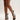 A person models the AZALEA WANG MICAELA BLACK SILVER RHINESTONE OPEN TOE LACE UP STILETTO BOOTIE, showcasing its dazzling rhinestones, cut-out design, and lace-up ankle ties against a plain background. The stiletto pairs seamlessly with a chic black outfit.