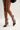 A person models the AZALEA WANG MICAELA BLACK SILVER RHINESTONE OPEN TOE LACE UP STILETTO BOOTIE, showcasing its dazzling rhinestones, cut-out design, and lace-up ankle ties against a plain background. The stiletto pairs seamlessly with a chic black outfit.