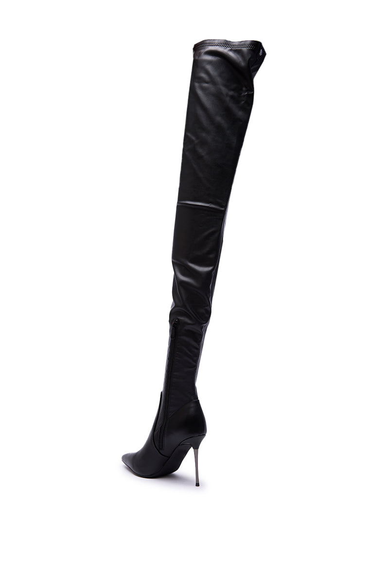 The AZALEA WANG MILANDRA BLACK THIGH HIGH SEXY BOOT is a sleek faux leather stiletto with a pointed toe and side zipper, shown in black against a white background.