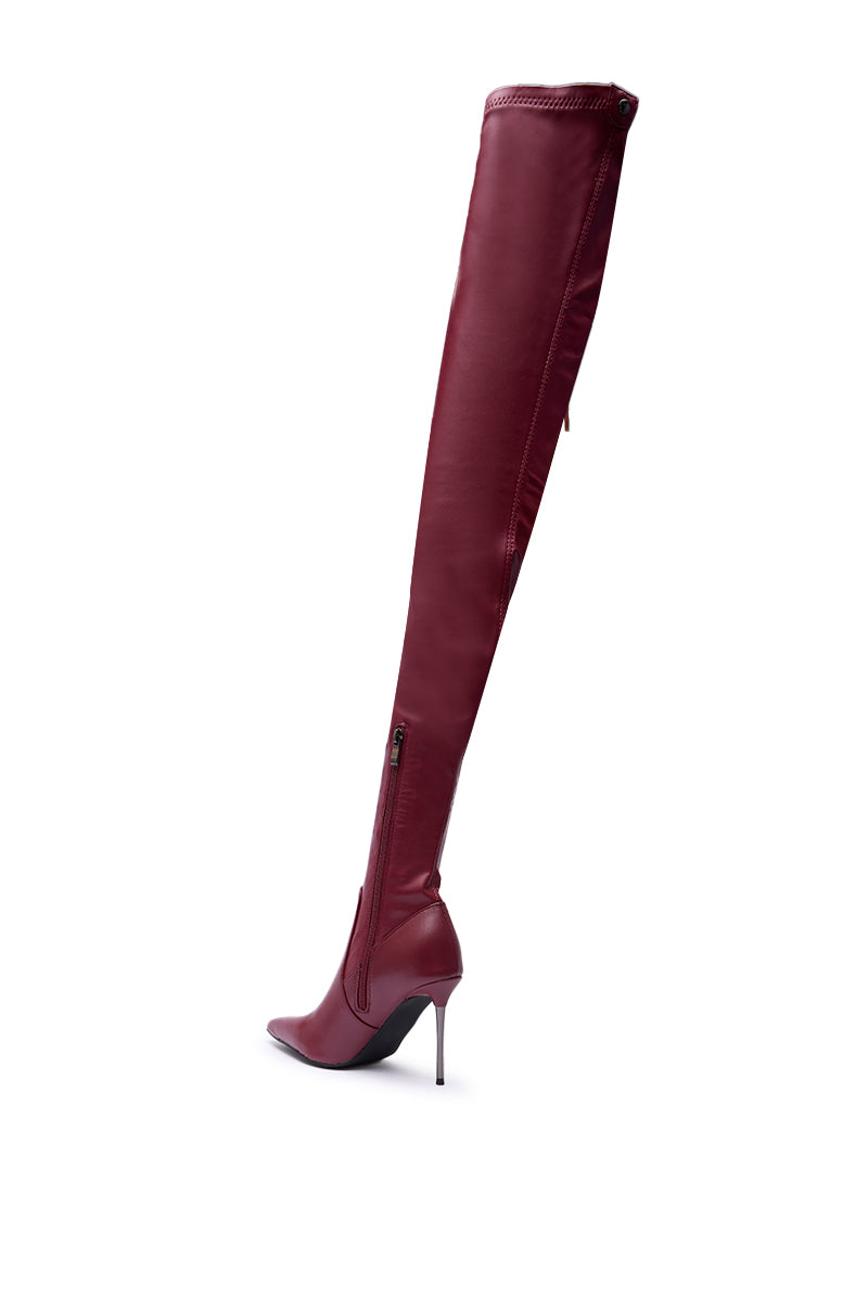 The AZALEA WANG MILANDRA Burgundy Stretch PU Thigh High Boot, featuring a tall stiletto heel and pointed toe, is displayed from the side against a white background.