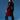 A woman stands against a blue background wearing the shiny red MITICA PATENT TRENCH COAT and black ruffled high-heeled boots, looking over her shoulder with a confident expression.