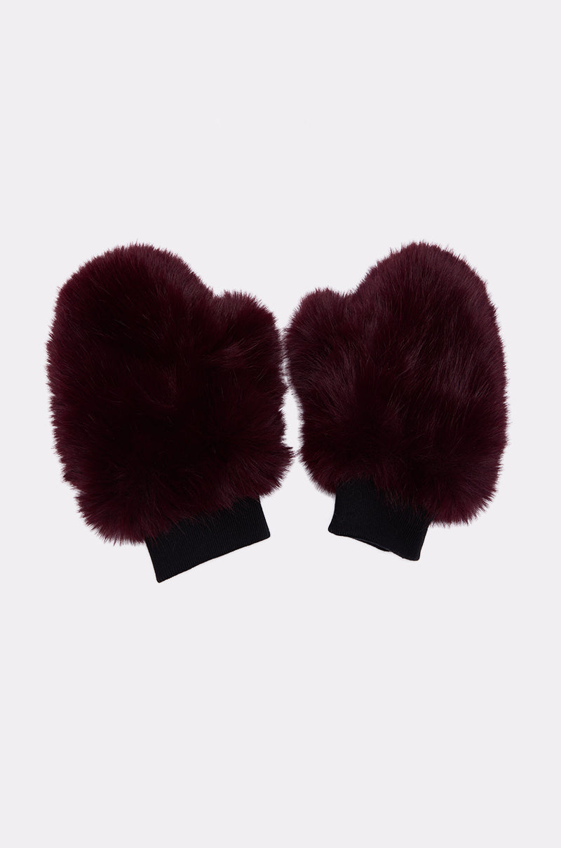 ALAIA FAUX FUR MITTENS: A pair of burgundy faux fur mittens with black elastic cuffs, ideal for cozy winter wear, displayed side by side on a plain white background. 4