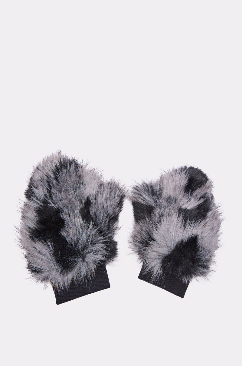 The ARLO FAUX FUR MITTENS feature a plush faux fur design with black and grey spots and black stretchy cuffs, perfect for elevating your winter wardrobe. Displayed on a plain white background. 6