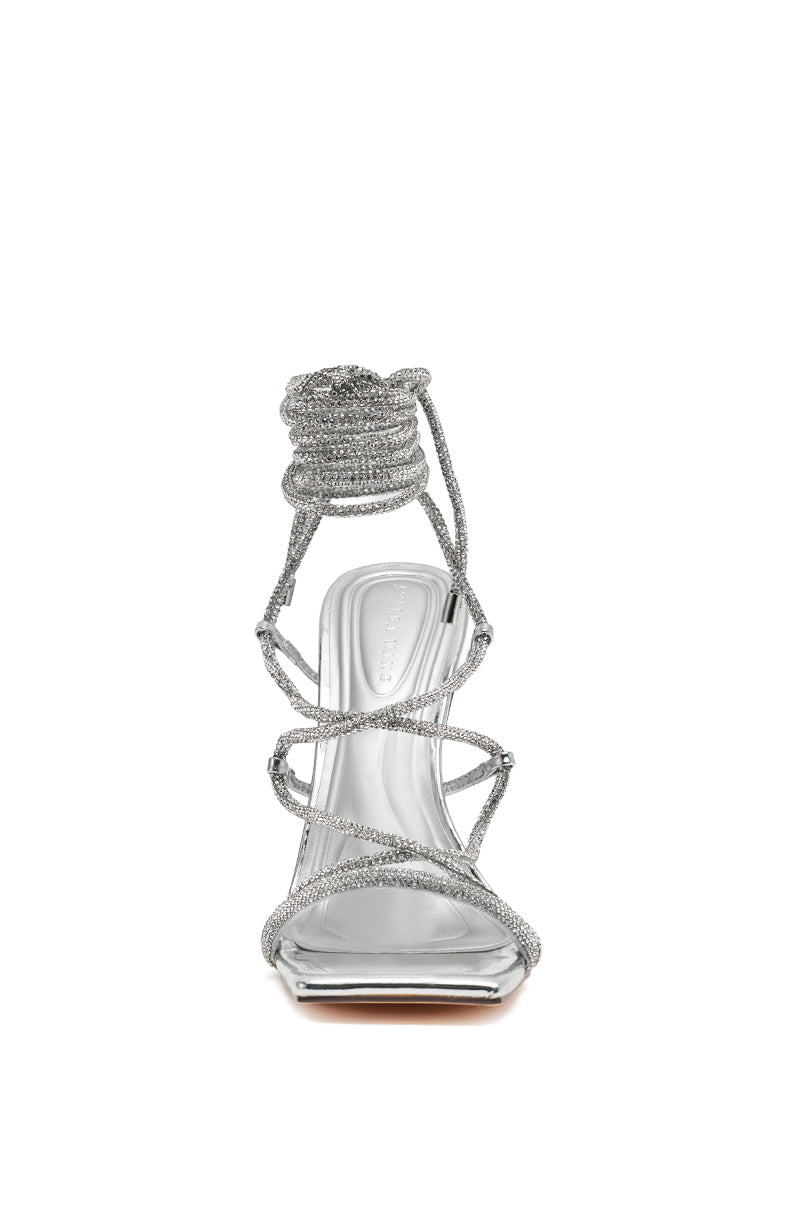 Front view of the AZALEA WANG MOEY Silver Stiletto Sandal with a square toe and sparkly rhinestone ankle-wrap straps, displayed on a white background.