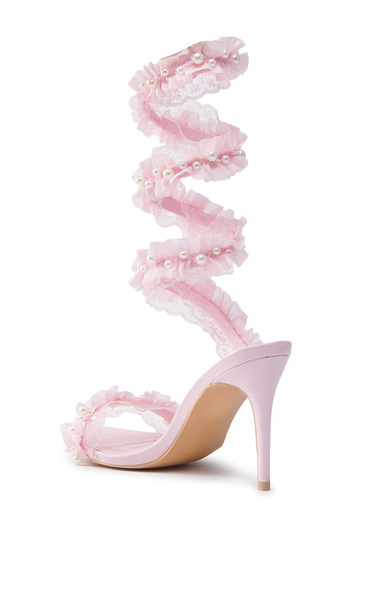 The AZALEA WANG MORINE PINK WITH PEARLS SPIRAL STILETTO SANDAL features a spiral ankle strap with lace, ruffles, and pearl beads for a delicate look. Its slender heel elegantly complements the natural beige sole and interior.