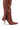 Close-up of the AZALEA WANG MOSSY TAN BOOT showcasing a brown leather knee-high design with a pointed toe, thin high heel, and a silver zipper extending from the ankle to the top. The partially undone zipper reveals the boot's internal lining.