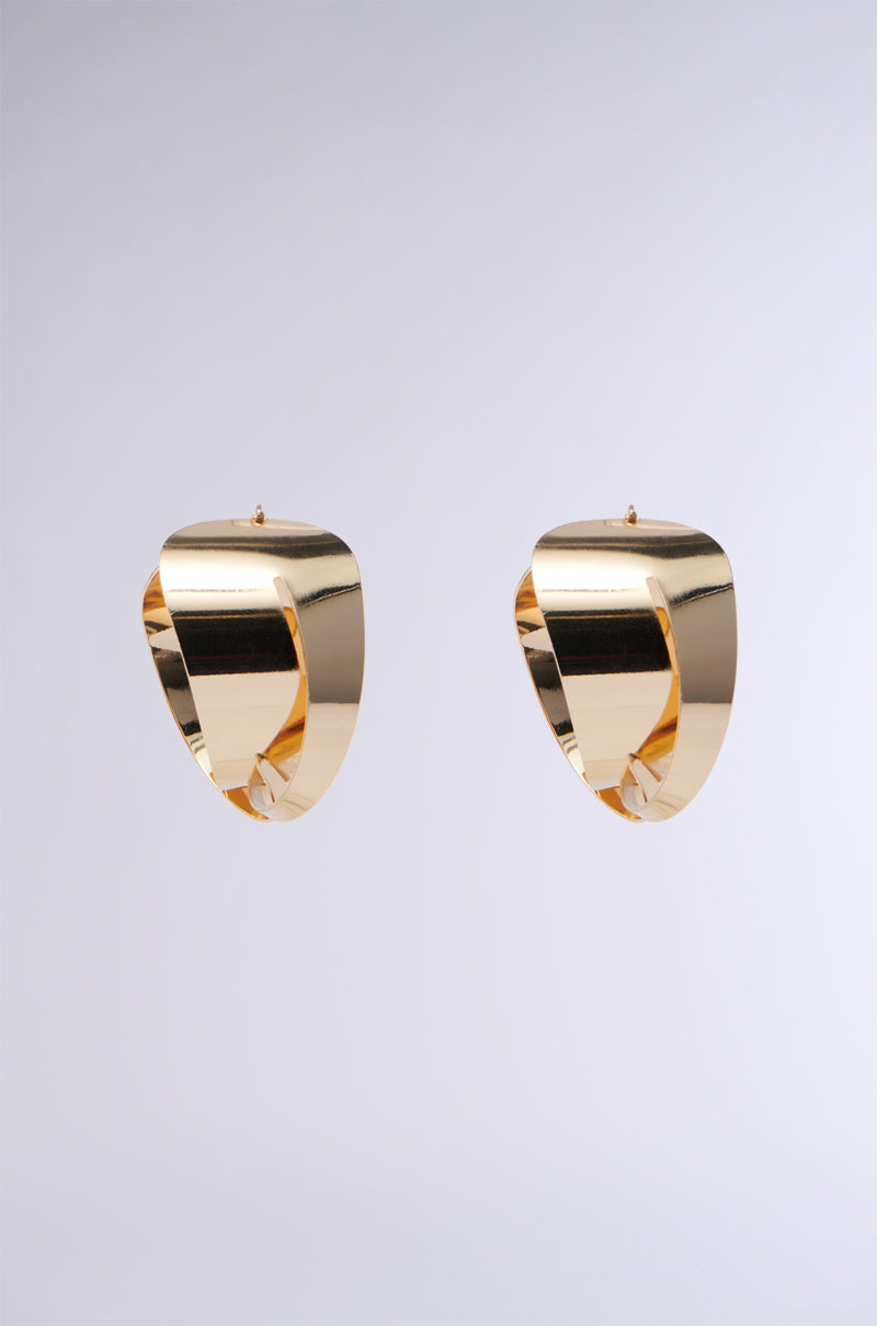 The WRAPPED UP EARRING, featuring a glossy chunky gold hoop design with a braid-like pattern, is elegantly displayed against a plain gray background.