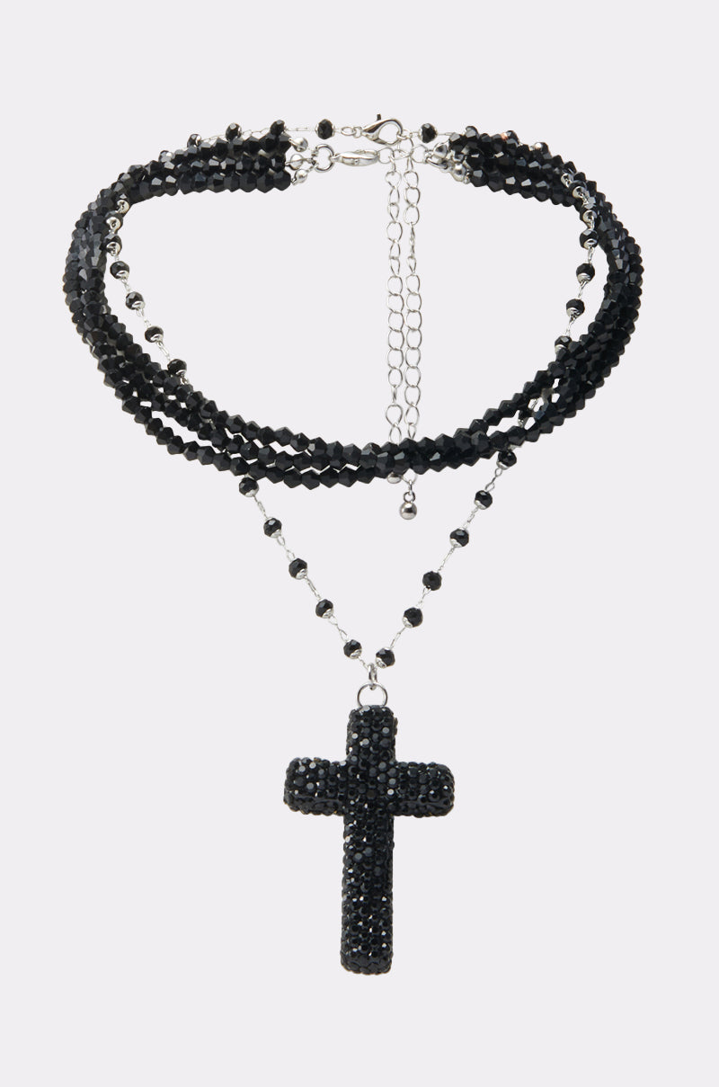 The DOLCE NECKLACE is a black multi-strand beaded gothic piece, featuring an adjustable silver clasp and a bold rhinestone cross pendant for ultimate vampiress style. 0