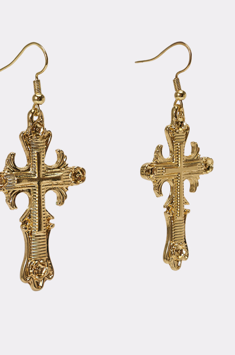 The CHARMED LIFE NECKLACE is a gold statement piece with intricate details, showcased against a plain white background. 8