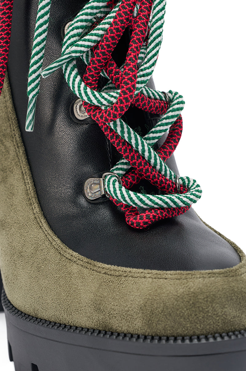 The AKIRA GOLD MUFFLER GREENMULTI CHUNKY HEEL BOOTIE showcases green suede, black leather, thick red and green striped laces through metal eyelets, and a sturdy platform lug sole.