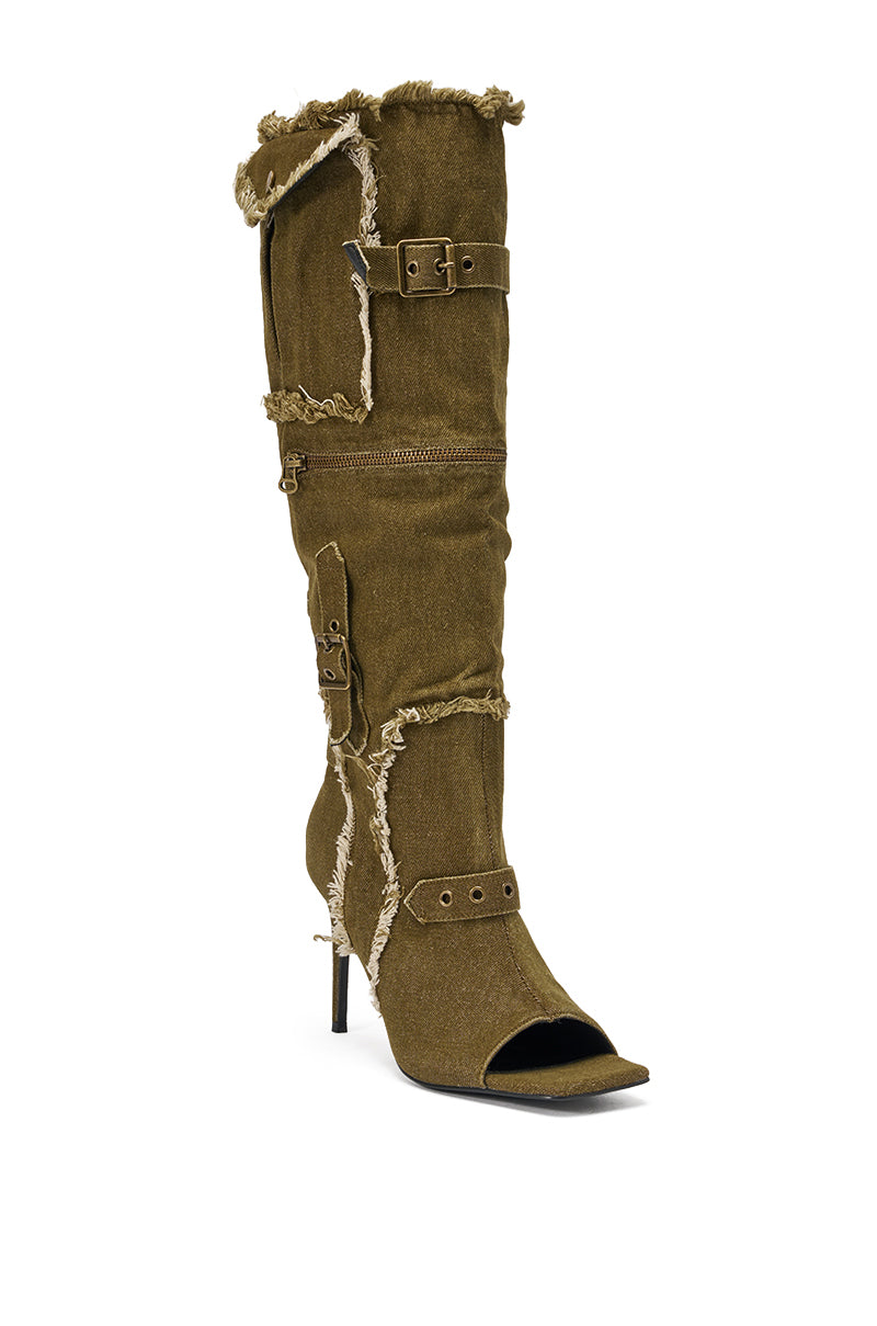 Step out in style with the AKIRA GOLD NADAL OLIVE CANVAS OPEN TOE STILETTO BOOTIE—an edgy, knee-high boot featuring distressed olive canvas, decorative straps, buckles, side zipper details, and a fashion-forward stiletto heel. 4
