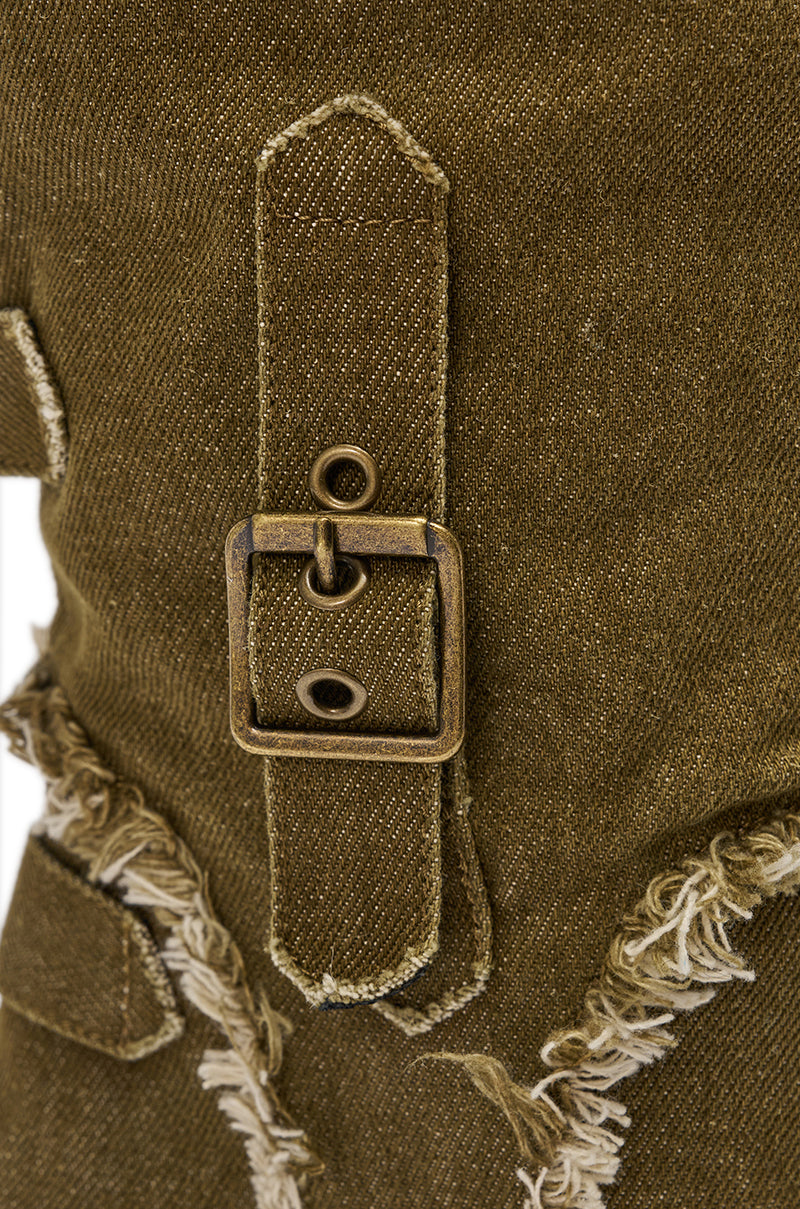 Close-up of the AKIRA GOLD NADAL OLIVE CANVAS OPEN TOE STILETTO BOOTIE, highlighting olive green canvas, a brass buckle and strap, visible stitching, and frayed edges for a distressed cargo boot-inspired look. 6