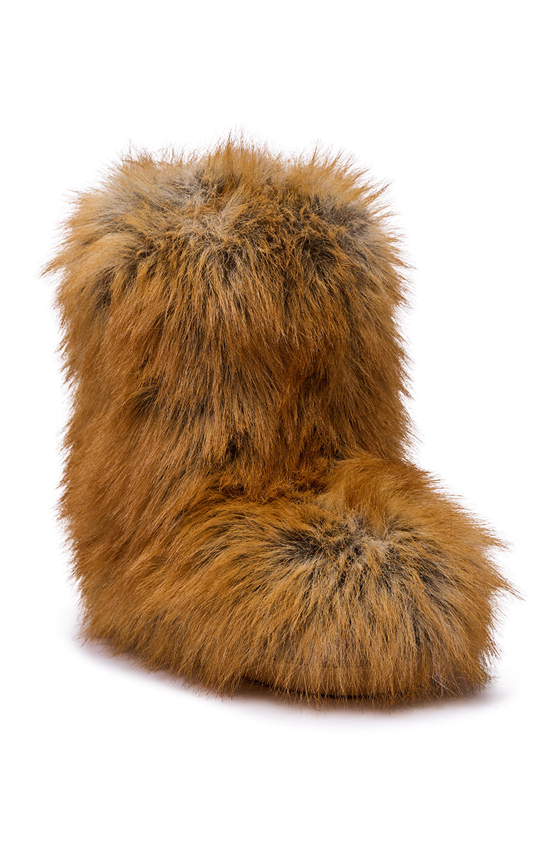 The AZALEA WANG NADIANNA TAN FLAT FUR BOOTIE features thick, light brown faux fur with darker brown and gray highlights, displayed at an angle against a white background.