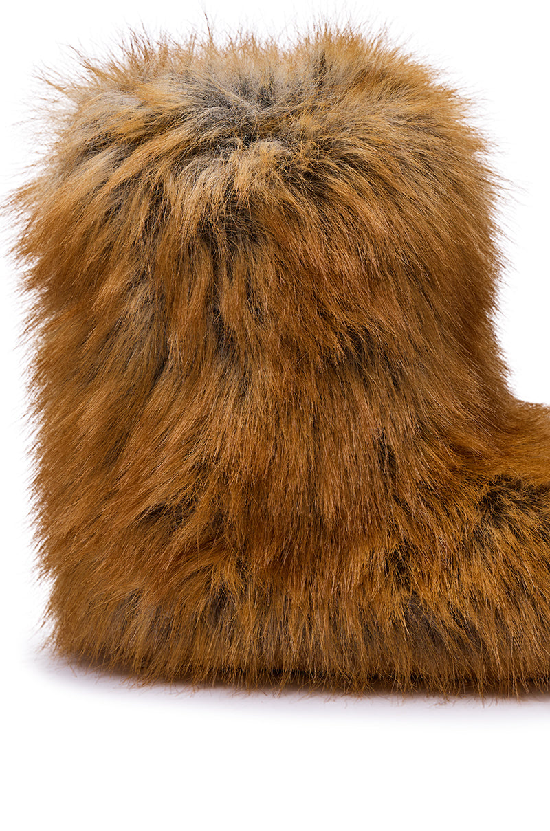 A close-up side view of the AZALEA WANG NADIANNA TAN FLAT FUR BOOTIE, featuring fluffy brown faux fur, set against a white background.