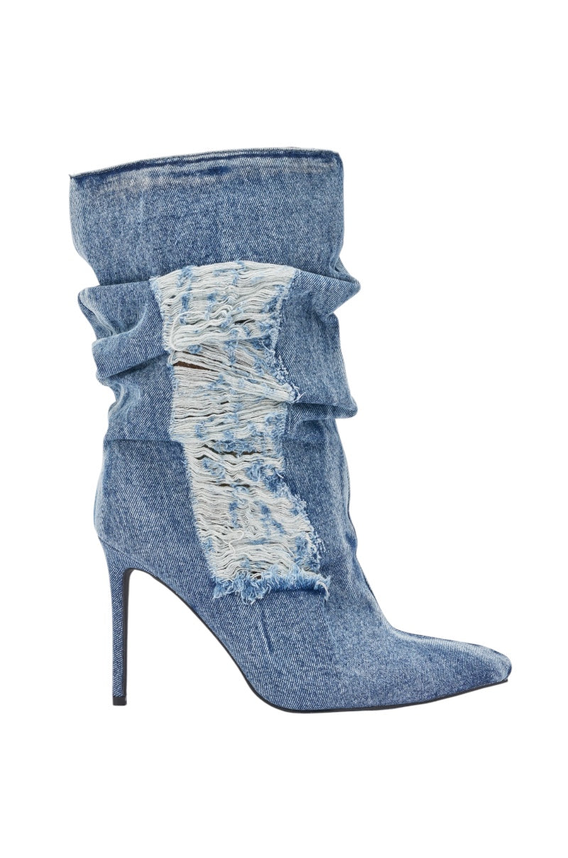 The AZALEA WANG NAELIA DENIM STILETTO BOOTIE is a bold, high-heeled pointed-toe bootie in blue denim with a slouchy shaft and frayed distressed patch—perfect for streetwear or festival outfits. 3