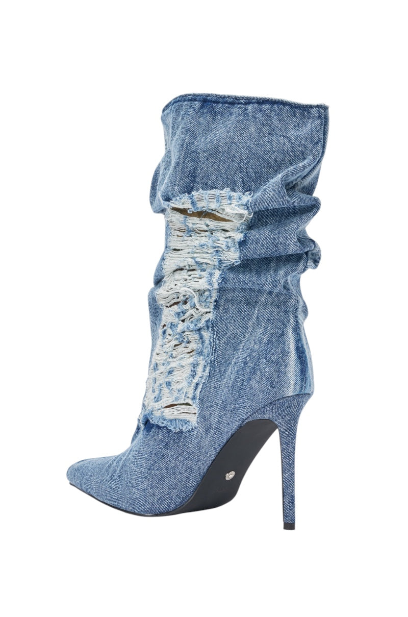 The AZALEA WANG NAELIA DENIM STILETTO BOOTIE is a blue denim, high-heeled, pointed toe streetwear boot with a slouchy shaft and prominent distressed detailing on the front. 5
