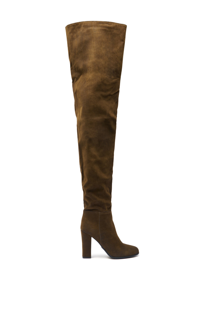 The AZALEA WANG NANETTE BROWN FAUX SUEDE ROUND TOE SLOUCHY BOOT is shown in profile against a white background, featuring an over-the-knee design, high block heel, and slouchy brown faux suede material.