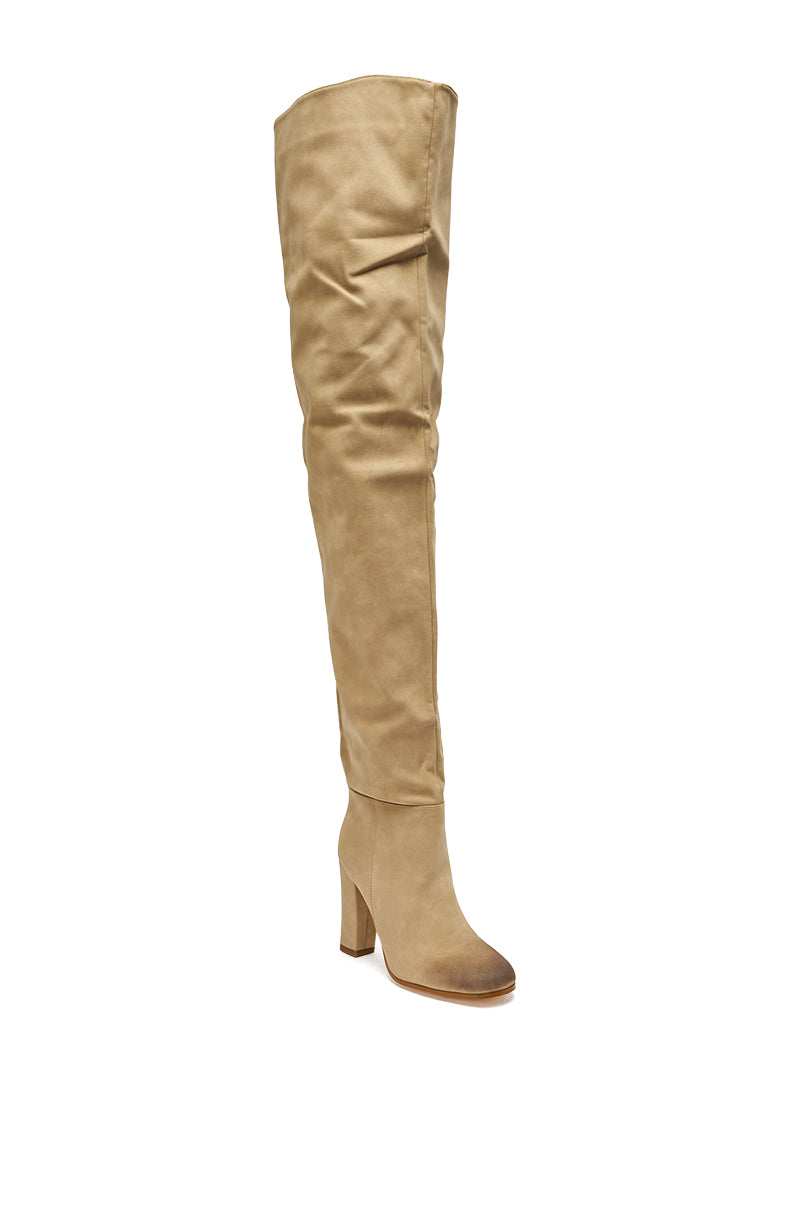 The AZALEA WANG NANETTE TAUPE SLOUCHY BOOT is a tan faux suede thigh-high boot with a chunky block heel, slightly slouched shaft, and rounded toe, shown on a white background.