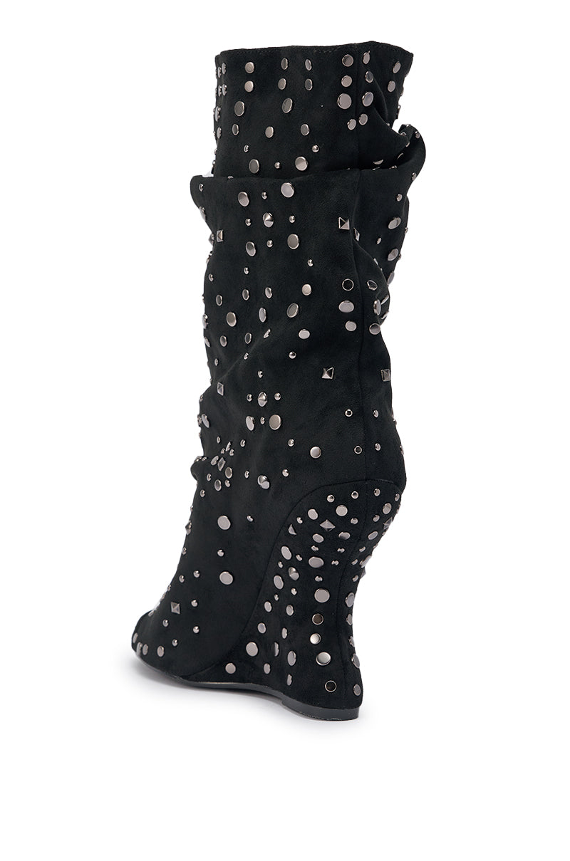 The AZALEA WANG NAOMANI Faux Suede Black Studded Open Toe Bootie features silver studs, circular embellishments, and a sculpted wedge heel in soft faux suede. These standout mid-calf booties add bold style to any outfit. 7