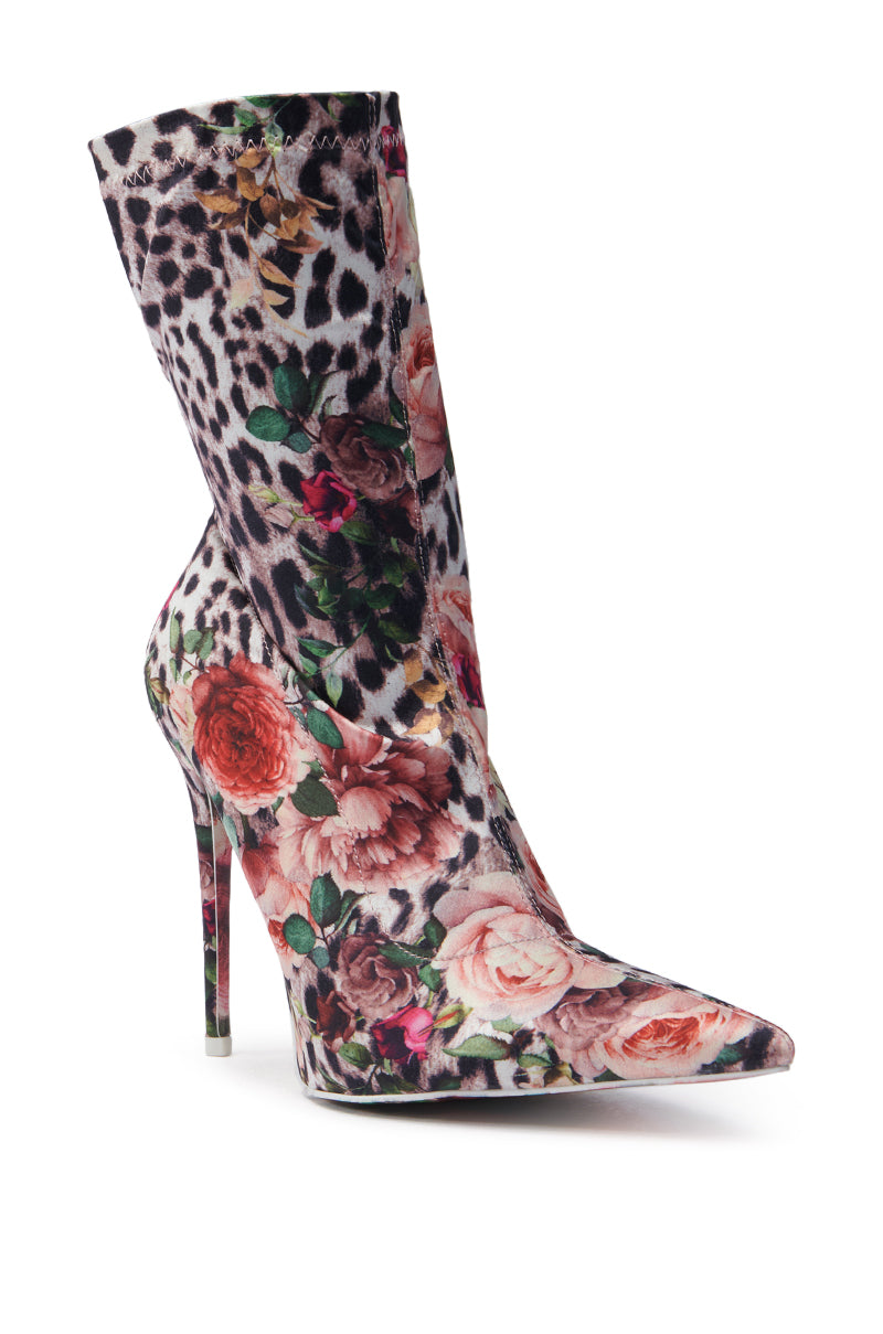 Discover the AZALEA WANG Narcissus Multi Floral and Leopard Bootie featuring a satin textile upper with vibrant roses overlaying leopard spots, all highlighted by a sleek stiletto heel.