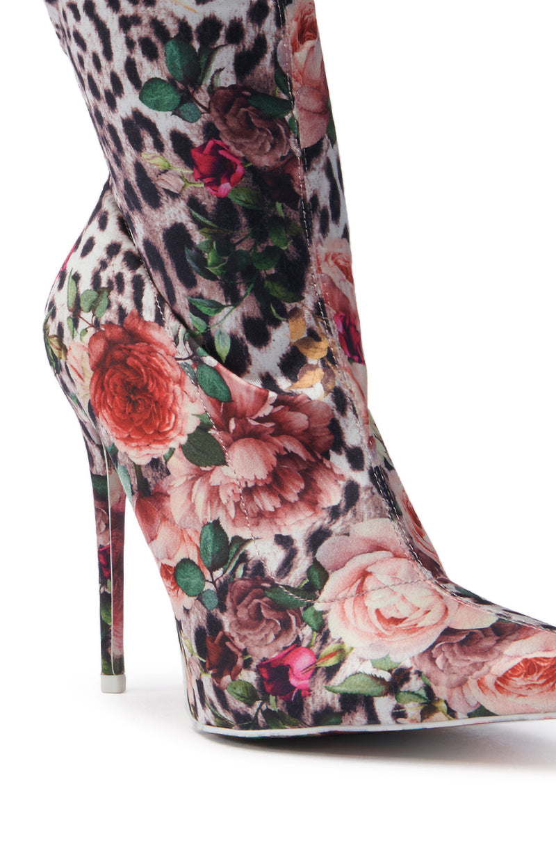 The AZALEA WANG NARCISSUS MULTI FLORAL AND LEOPARD BOOTIE features a striking stiletto design with vibrant floral and leopard prints on an elegant satin textile upper.