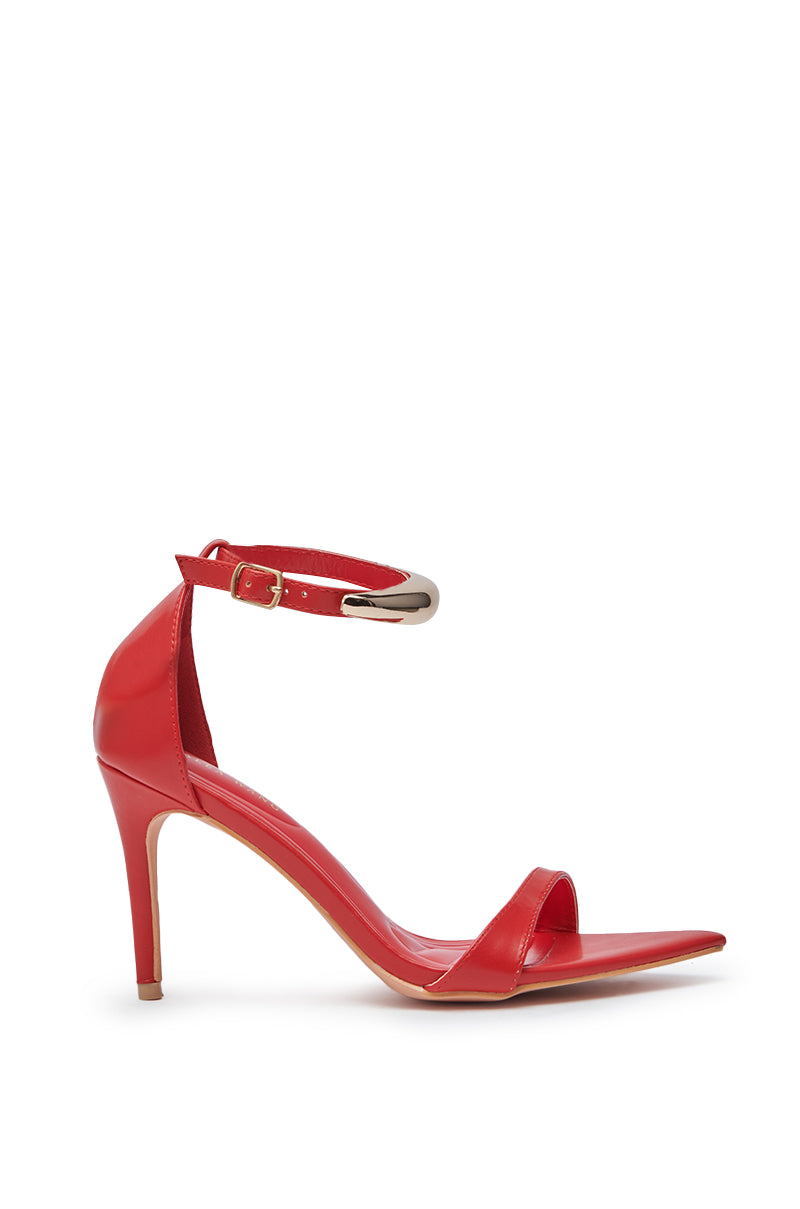 The AZALEA WANG NEMTI RED PU WITH GOLD EMBELLISHMENT SANDAL is a glossy red stiletto featuring faux patent leather, a gold-embellished ankle strap, single toe strap, and pointed heel for an effortlessly chic style. 2