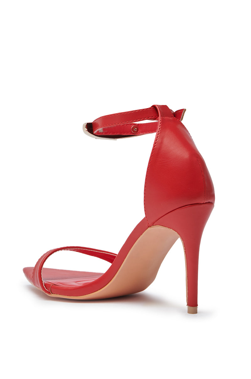 The AZALEA WANG NEMTI Red PU Sandal with gold embellishments is shown from a rear side angle, featuring an ankle strap and open toe, displayed on a white background. 4