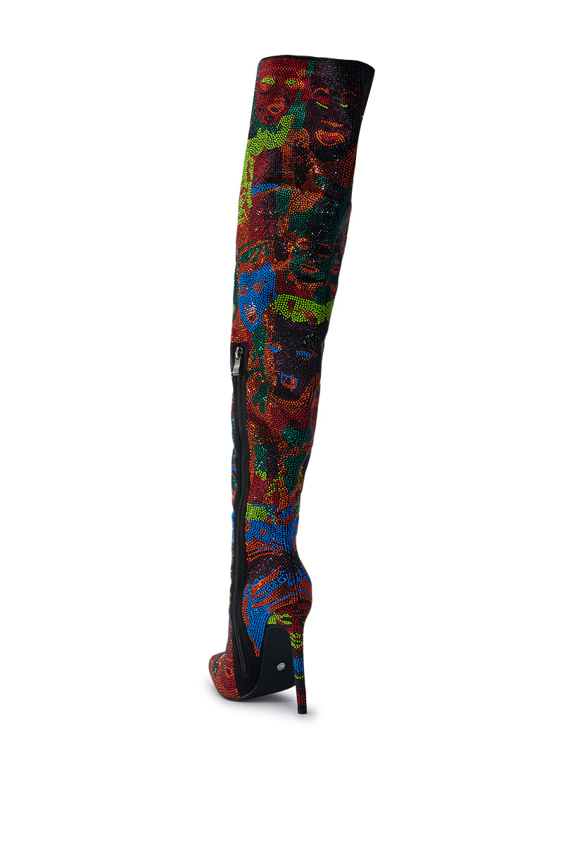 Introducing the AZALEA WANG NERISSA MULTI STILETTO THIGH HIGH BOOTS, featuring a rhinestone-embellished design with colorful abstract patterns and a peep-toe silhouette. These boots boast rich hues of red, blue, green, and orange for a vibrant look and include a convenient side zipper that runs down their length.