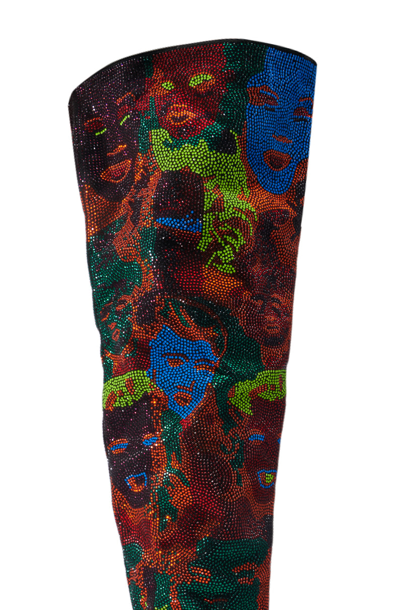 Introducing the AZALEA WANG NERISSA MULTI STILETTO THIGH HIGH BOOTS, featuring a vibrant pattern of abstract face designs in shades of blue, green, red, and orange set against a richly textured dark background.