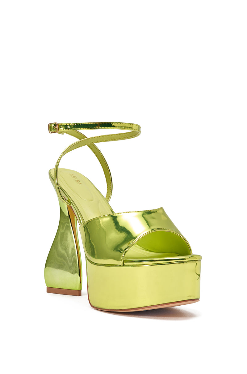 The AKIRA GOLD NEWTON GREEN BLOCK HEEL SANDAL features a shiny, metallic lime green finish with a chunky block heel, open toe, and slim ankle strap for a bold statement look. 3