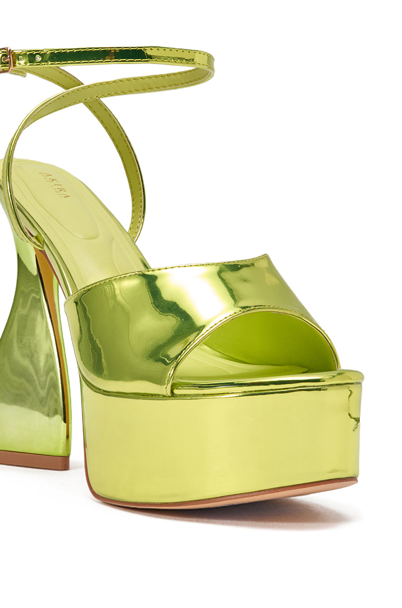 Step out in style with the AKIRA GOLD NEWTON GREEN BLOCK HEEL SANDAL—featuring a glossy lime green finish, chunky platform heel, open toe, thick sole, and ankle strap for bold party-ready vibes. 5